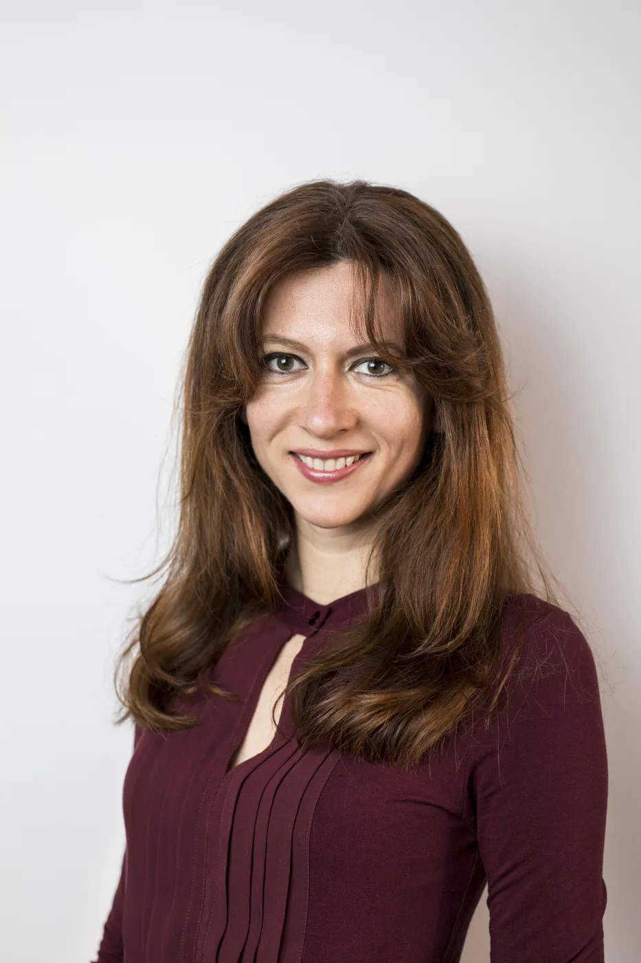 Portrait of Laura Vincze in a plum blouse